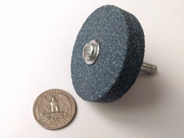 A grinding wheel and a US Quarter coin